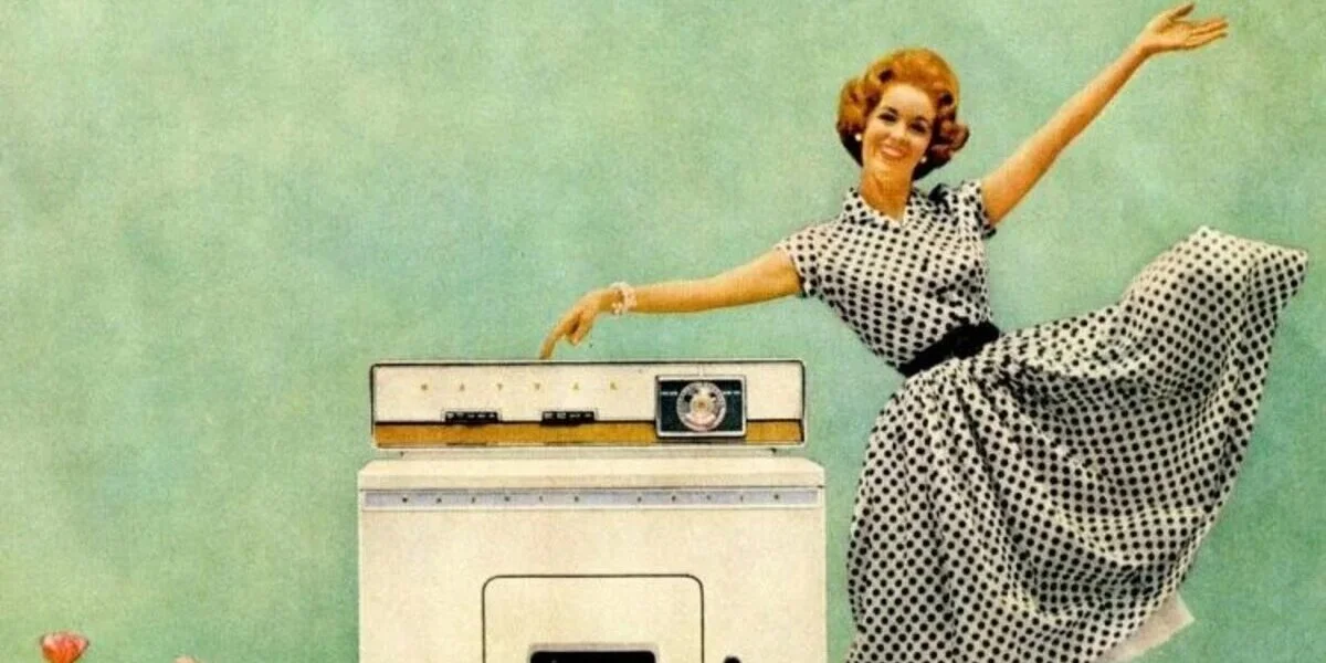 Happy wife smiling while doing laundry